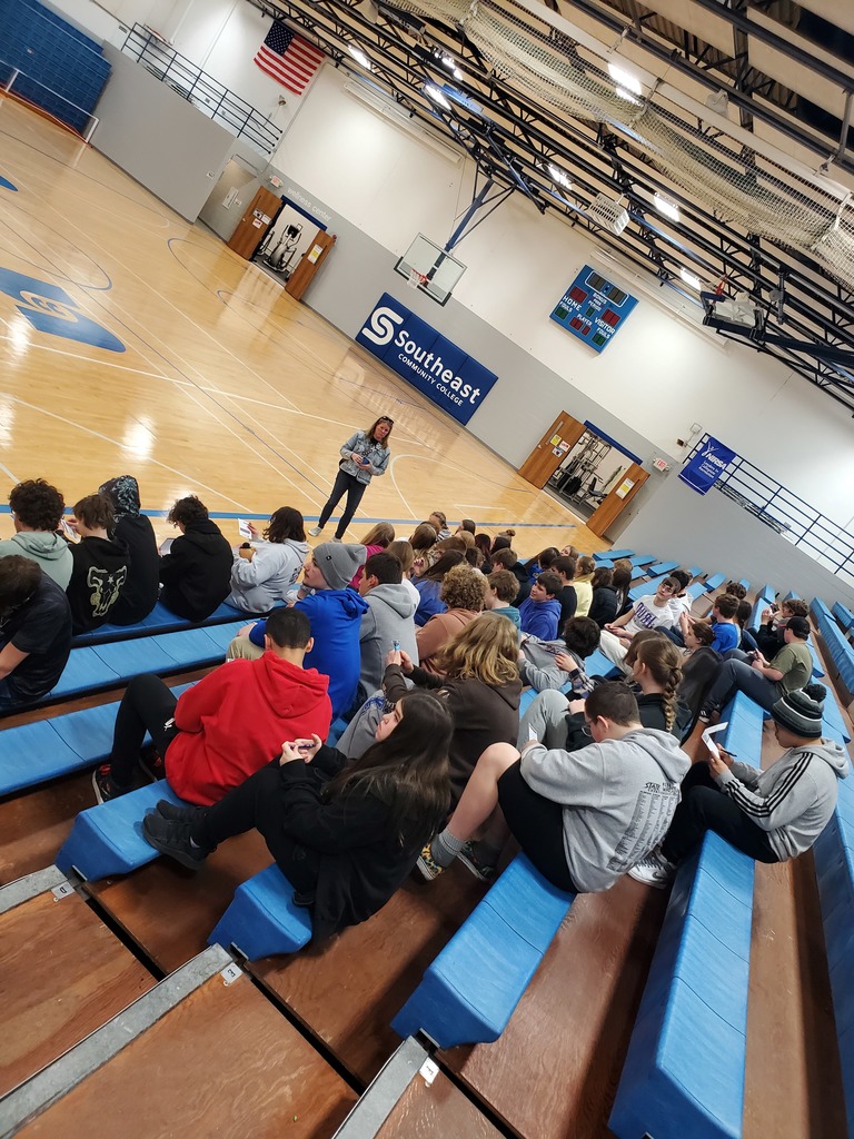 students sitting in bleachers