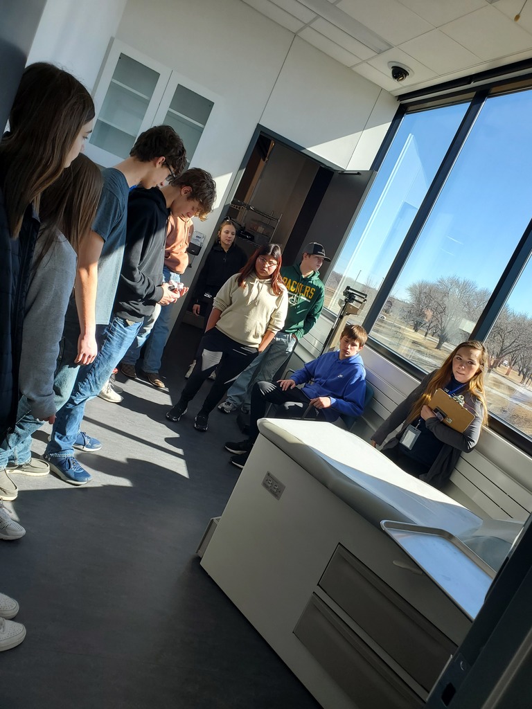 Students viewing a lab room in the healthcare facility
